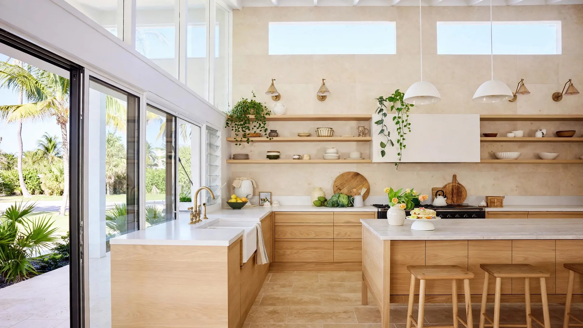 Kitchen with a finished travertine-look panel wall, open shelving and oak cabinets